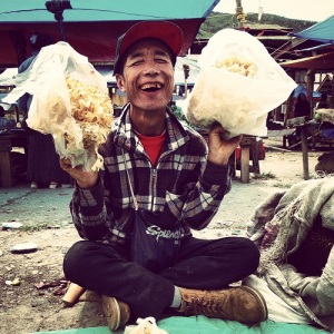 Man sells his mushrooms which he has picked from the forest at Paro local Sunday Market
